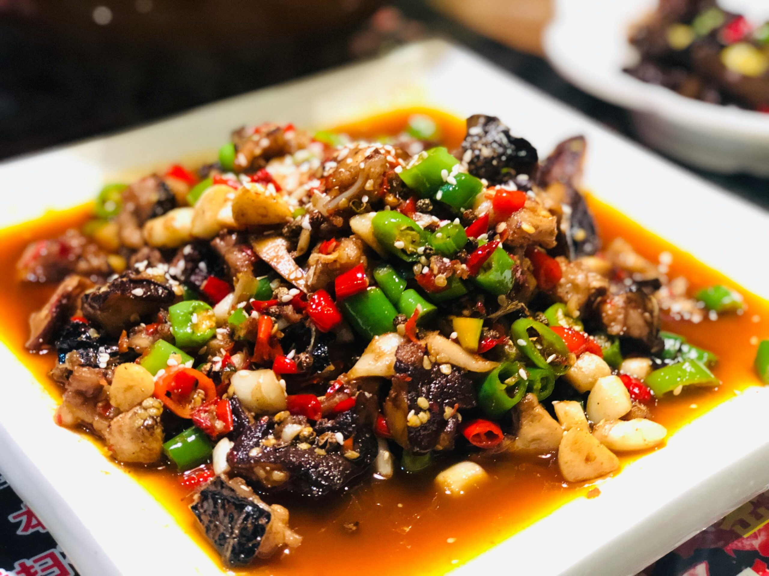 Delicious Szechuan beef stir fry with fresh peppers and garlic, captured up-close.